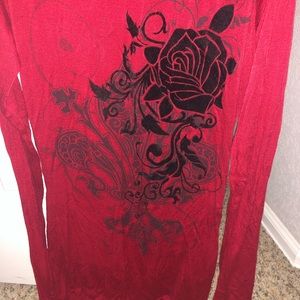 Red shoulder cut out top with black design